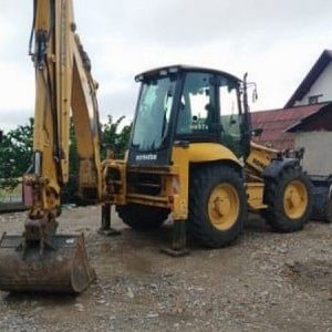 foto Komatsu WB97S 4buckets backhoe loader