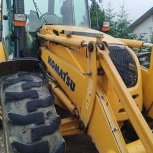 foto Komatsu WB97S 4buckets backhoe loader